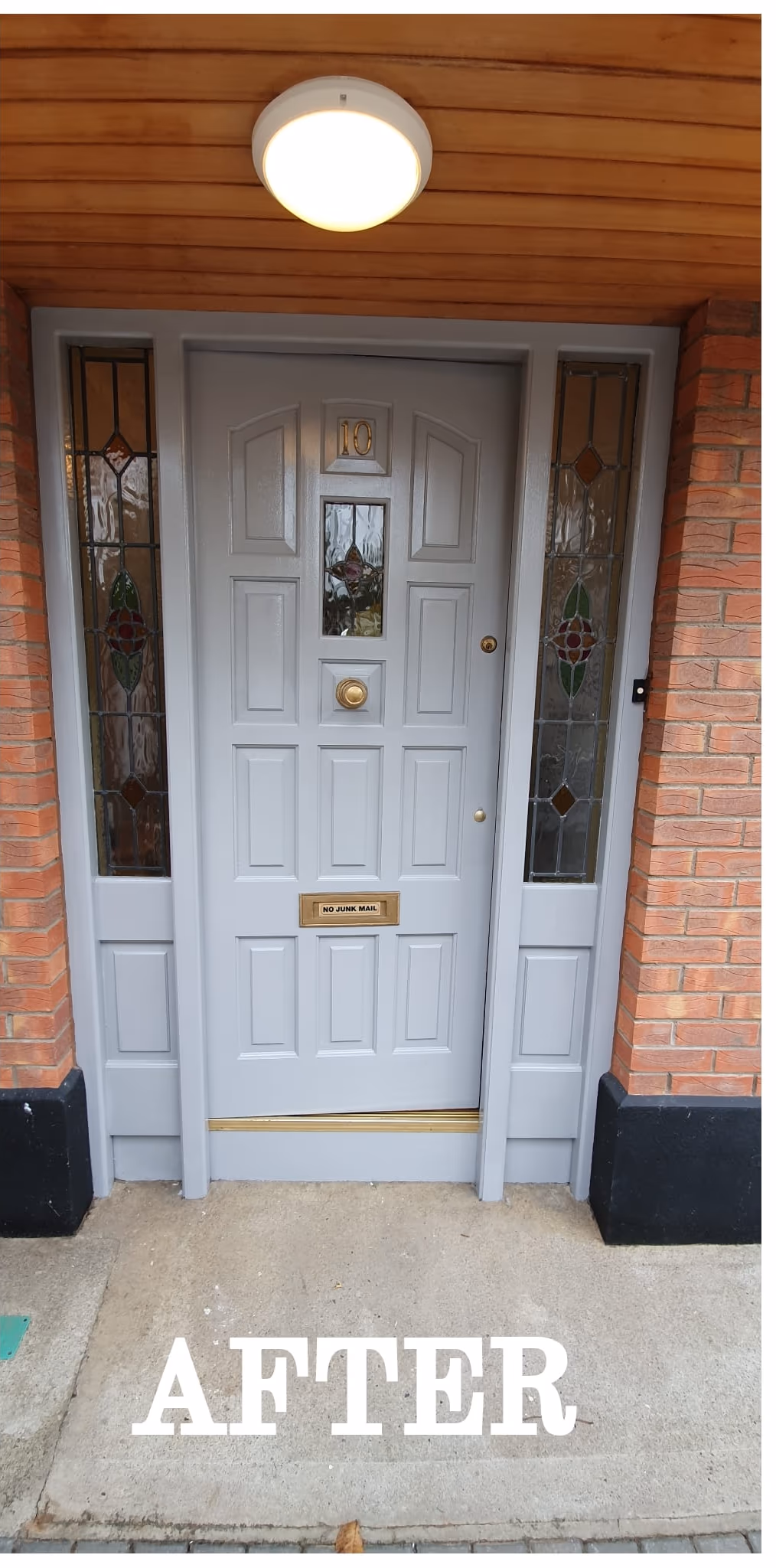 Period front door resprayed grey with polished brass hardware in Dublin