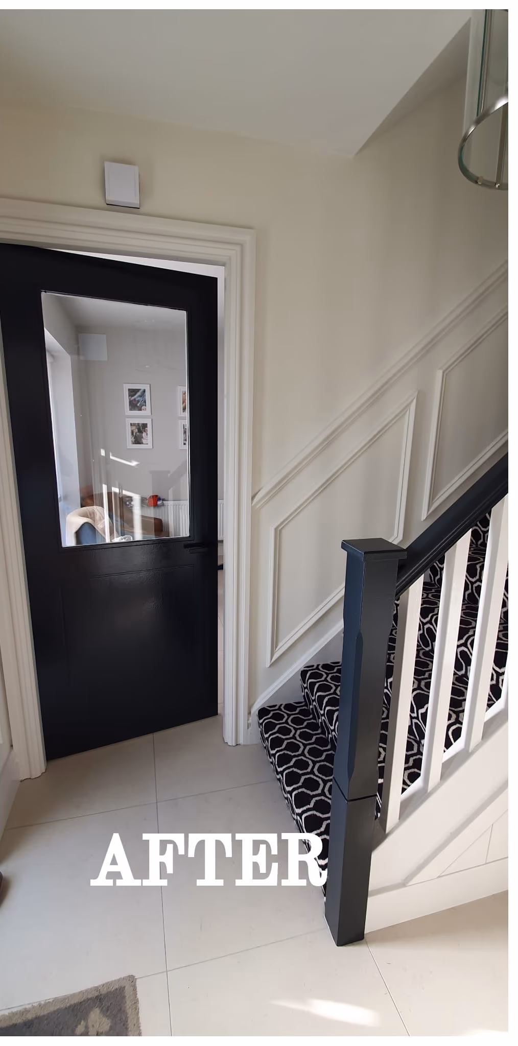Hallway repaint with a black internal door and white panelling in Dublin