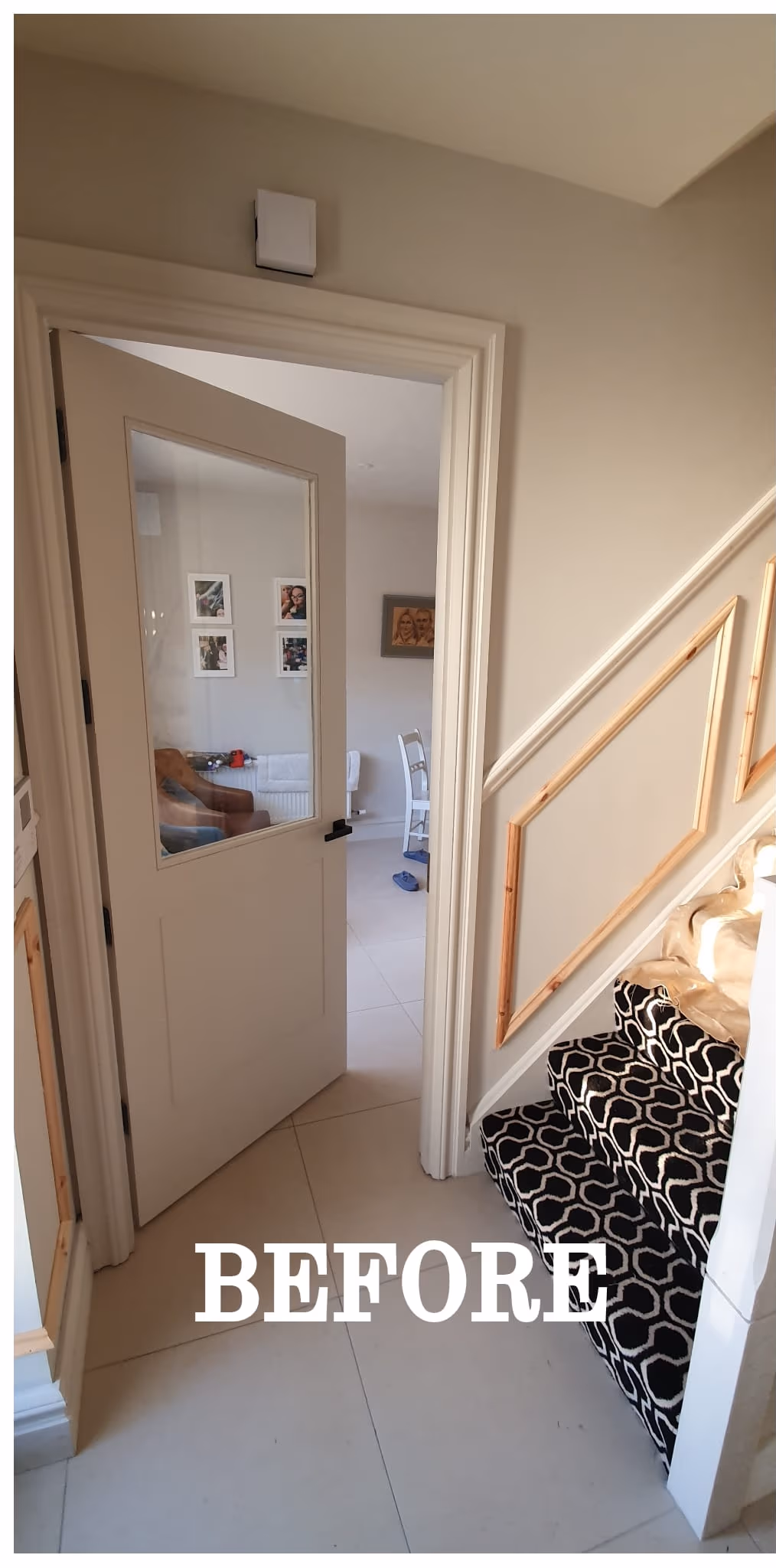 Hallway repaint with a black internal door and white panelling in Dublin — image 2 of 2
