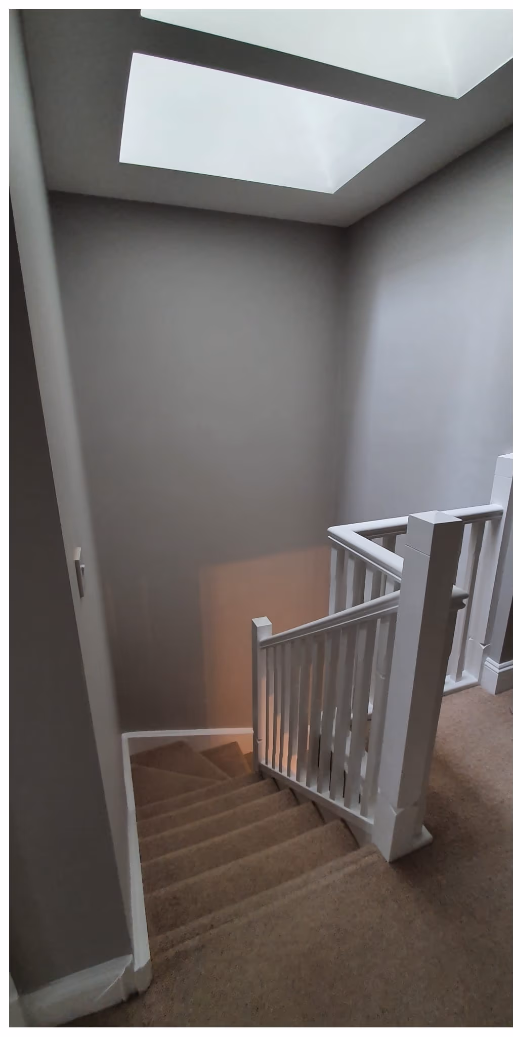 First-floor landing repainted in a bright neutral grey in Dublin — image 2 of 2