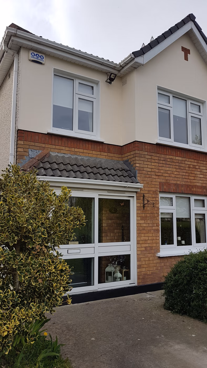 Brick and white terraced house exterior painted in Dublin