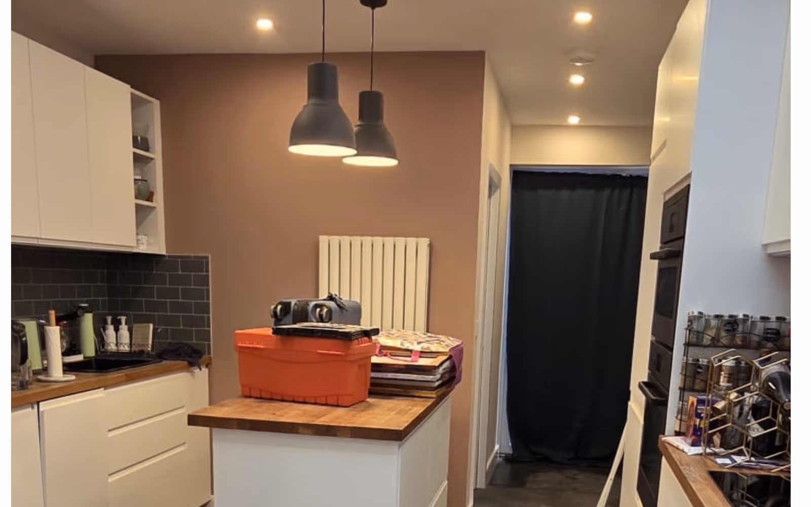 Freshly painted kitchen with white units and a wood worktop in Dublin